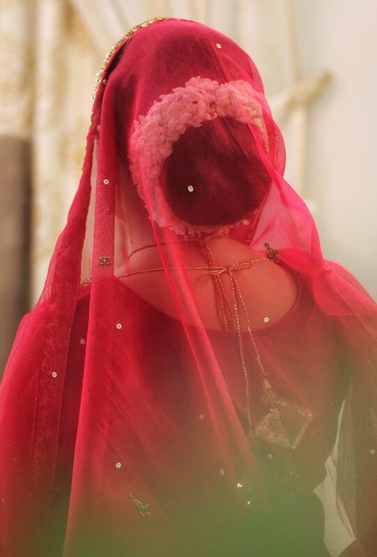 Bride in red veil.
