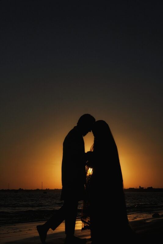 Couple silhouette at sunset.