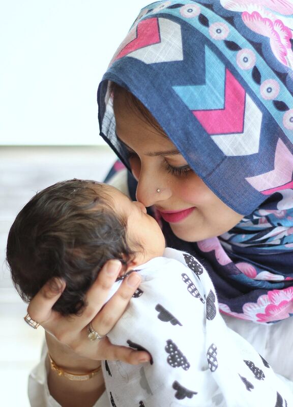 Mother kissing baby